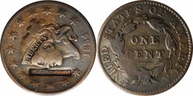 Counterstamps

R. MOORE in a serrated box punch on an 1834 Matron Head large cent. Brunk M-848, Rulau-Unlisted. Host coin Very Fine. 

Robert Moor...