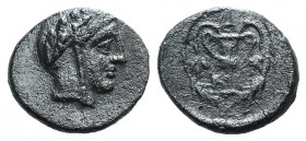Bithynia, Kios, c. 3rd century BC. Æ (12mm, 1.29g, 6h). Head of Mithras r., wearing a laureate tiara. R/ Kantharos with two grape vines within wreath ...
