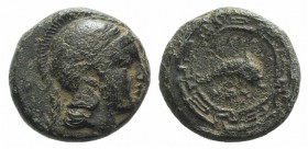 Ionia, Naulochos, c. 350-340 BC. Æ (9mm, 1.25g, 12). Head of Athena r., wearing crested Attic helmet. R/ Leaping dolphin within circular maeander patt...