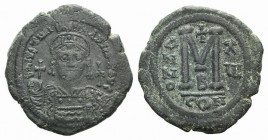 Justinian I (527-565). Æ 40 Nummi (36mm, 20.64g, 7h). Constantinople, year 16 (542/3). Helmeted and cuirassed bust facing, holding globus cruciger and...