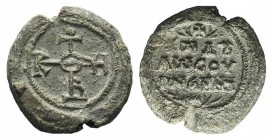 Byzantine Pb Seal, c. 7th-12th century (27mm, 21.35g, 12h). Cruciform monogram. R/ Legend in three lines. VF
