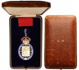 GREAT BRITAIN
The Order of the Companions of Honour
A Companion’s Badge (C.H.): neck decoration, 67x40 mm in gilt silver (British hallmark) enameled...