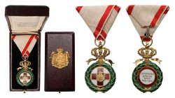 MONTENEGRO
Order of the Red Cross
A 1st Model Badge, 52x32 mm, in gilt Silver, with 
white enameled centre medallion charged by the red 
enamelled...
