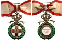 MONTENEGRO
Order of the Red Cross
A Badge of the 3rd Model, 55x32 mm,in gilt Silver and enamels, 
with separately made medallions, the obverse with...