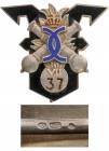 ROMANIA
Badge of the 37th Artillery Regiment 
Breast Badge, 47x42 mm, Silver, hallmarked "900", maker's mark "KK", one side enameled, vertical pin o...