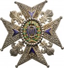 SPAIN
Order of Charles III
A Numerary Commander’s Breast Star, 65x61 mm, diamond-cut chiselled silver cross 
flanked by fleurs-de-lys, the arms wit...