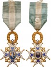 SPAIN
Order of Charles III
A Knight’s Cross of the Order in GOLD, 66x45 mm, white/blue enameled arms with 
ball-finials, flanked by chiselled fleur...