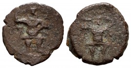 Ebusus. 1/4 calco. 300-200 BC. Ibiza. (Abh-909). Anv.: Bes with hammer and serpent, in the caduceus field and Punic letter Waw. Rev.: Similar to the o...