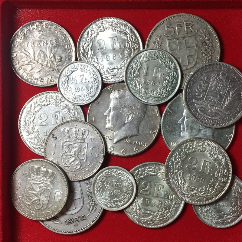 World Coins. Lotto 16 monete mondiali in argento. Conservazioni da BB a FDC