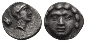 Pisidia, Selge, ca. 300-190 BC
Facing gorgoneion.
Helmeted head of Athena right, behind astragalos
SNG COP 246. 
9.3mm / 0.9g