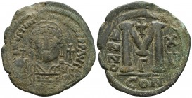 Justinian I 527-565 AD, AE follis Constantinople Mint, 541/542 AD.
DNIVSTINI-ANVSPPAVC Facing bust of Justinian I cuirassed in plumed helmet, in right...