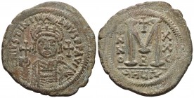 Justinian I 527-565 AD, AE follis, Antioch (Theoupolis) Mint, 552/553 AD. 
DNIVSTINI ANVSPPAVC Facing bust of Justinian I cuirassed in plumed helmet, ...