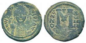 JUSTINIAN I. 527-565 AD.Cyzicus mint.AE Follis. DN IVSTINIANVS PP AVG, helmeted, cuirassed bust facing, holding cross on globe and shield with horsema...