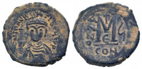 MAURICE TIBERIUS. 582-602 AD. Constantinople mint.AE Follis. DN MAVRIC TIBER PP AVG, Helmeted and cuirassed bust facing, holding cross on globe and sh...