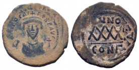 PHOCAS. 602-610 AD. Constantinople mint.AE Follis. DM FOCAE PP AVG, crowned, mantled bust facing, holding mappa and cross / Large XXXX, ANNO above, re...
