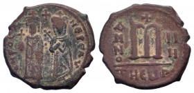 PHOCAS. 602-610 AD. Constantinople mint. AE Follis.O N FOCA NЄ PЄ AV, Phocas on left and Leontia on right, standing facing; he holds a globus cruciger...