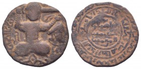 ARTUQIDS.Husam Ad-Din Yuluq-Arslan.1184-1201 AD.No mint.596 AH.AE Dirham. Perseus seated with sword behind his head and holding the head of Medusa in ...
