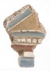 DECORAZIONE IN STUCCO DIPINTO
 I - II secolo d.C.; alt. cm 13,5; largh. cm 9,8; plexiglass cm 20 x 15; PROVENIENZA Collezione privata, Roma.