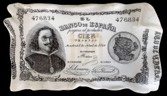 Cenicero reproduciendo un billete de 100 pesetas del 1 de abril de 1880, Quevedo. Muy curioso. 241,45 g. MBC+.