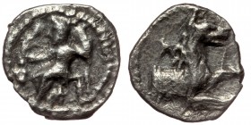 LYCAONIA. Laranda. Obol (Circa 324/3 BC).
Baal seated left on throne, holding grain ear, grape bunch and sceptre.
Rev: Forepart of wolf right; inverte...