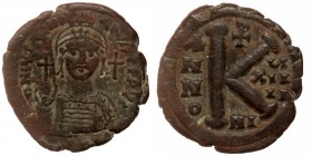 BYZANTINE EMPIRE. Justinian I, (527-565) AE27 Half Follis Nikomedia, year 19. 
D N [IV]STINIANVS P P AVG, Crowned bust facing 
Rev: Large K., Christog...