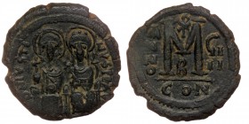 Justin II, with Sophia. (565-578) AE32 Follis Constantinople, 2nd officina. 
DN IVSTI NVS PP AVC, Justin, holding globus cruciger, and Sophia, holding...