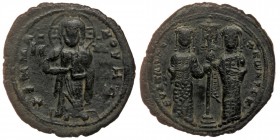 Constantine X Ducas and Eudocia AD 1059-1067. Constantinople Follis AE29
Christ standing facing on footstool, wearing nimbus and holding Gospels
Rev: ...