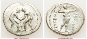 PAMPHYLIA. Aspendus. Ca. 325-250 BC. AR stater (25mm, 10.03 gm, 1h). About Fine, scratches. Two wrestlers grappling; K between / ΕΣΤFΕΔΙΥ, slinger sta...