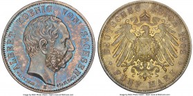 Saxony. Georg 5 Mark 1902-E MS66 NGC, Muldenhutten mint, KM1256, J-128. Commemorates death of Albert. Rose, teal and graphite toning. 

HID098012420...
