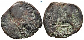 Heraclius AD 610-641. Overstruck on a Follis of Justin I. Uncertain Sicilian mint. Follis or 40 Nummi Æ