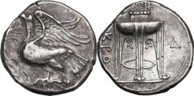 Greek Italy. Bruttium, Kroton. AR Stater, c. 350-300 BC. Obv. Eagle standing left on olive branch, with wings displayed and head raised. Rev. Tripod w...