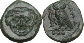 Sicily. Kamarina. AE Tetras or Trionkion, c. 420-405 BC. Obv. Gorgoneion. Rev. KAMA. Owl standing left, head facing, grasping lizard; three pellets in...