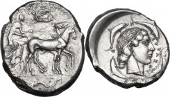 Sicily. Syracuse. Second Democracy (466-406 BC). AR Tetradrachm, circa 460-440 BC. Obv. Charioteer driving walking quadriga right, holding kentron and...