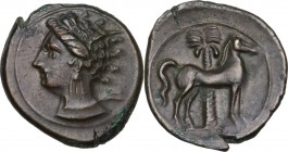 Punic Sardinia. AE 18 mm. Circa 360-330 BC. Uncertain mint. D/ Wreathed head of Kore left, wearing triple-pendant earring. R/ Horse standing right; in...