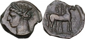 Punic Sardinia. AE 17 mm. Circa 360-330 BC. Uncertain mint. D/ Wreathed head of Kore left, wearing triple-pendant earring. R/ Horse standing right; in...