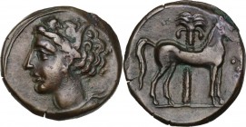 Punic Sardinia. AE 16 mm. Circa 360-330 BC. Uncertain mint. D/ Wreathed head of Kore left, wearing triple-pendant earring. R/ Horse standing right; in...