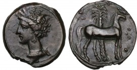 Punic Sardinia. AE 17 mm. Circa 360-330 BC. Uncertain mint. D/ Wreathed head of Kore left, wearing triple-pendant earring. R/ Horse standing right; in...