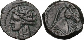 Punic Sardinia. AE 21 mm. Circa 300-264 BC. Uncertain mint. D/ Wreathed head of Kore left, wearing triple-pendant earring; on neck, incuse Punic lette...