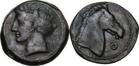 Punic Sardinia. AE 20 mm. Circa 300-264 BC. Uncertain mint. D/ Wreathed head of Kore left, wearing triple-pendant earring; on cheek, three pellets. R/...