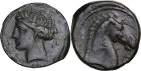 Punic Sardinia. AE 20 mm. Circa 300-264 BC. Uncertain mint. D/ Wreathed head of Kore left, wearing triple-pendant earring; behind, three (or two?) pel...