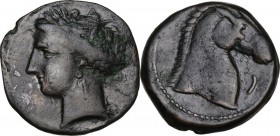 Punic Sardinia. AE 20 mm. Circa 300-264 BC. Uncertain mint. D/ Wreathed head of Kore left, wearing triple-pendant earring; on forehead, two pellets; o...