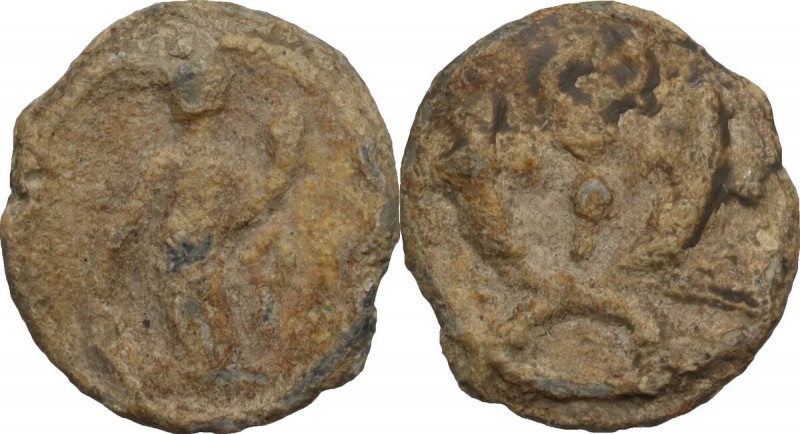 Tessera plumbea. D/ Fortuna stans sinistr. R/ Cornuacopiae duo decussata et in m...