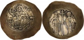 Manuel I Comnenus (1143-1180). EL Aspron Trachy, Constantinople mint. Obv. Christ, seated facing on throne without back, raising right hand in benedic...
