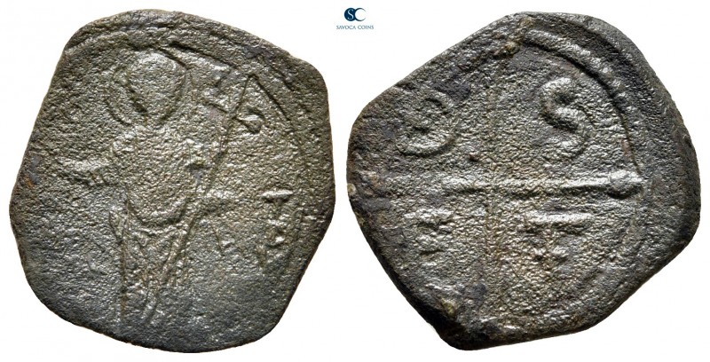 Tancred AD 1101-1103. Antioch
Follis Æ

20 mm, 2,36 g

St. Peter standing f...