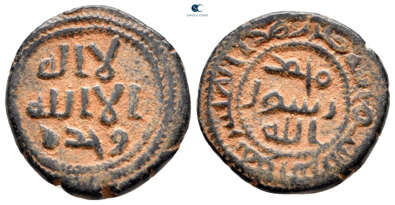Umayyad Caliphate. Qurus undated. 
Fals AE

19 mm, 3,77 g

Legends in three...