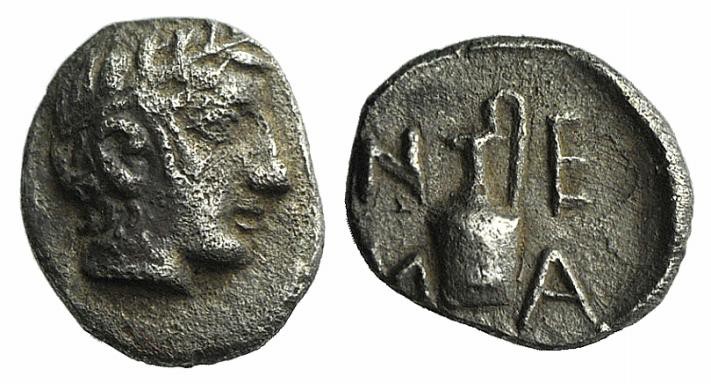 Troas, Neandria, 4th century BC. AR Tetartemorion (5mm, 0.25g, 3h). Laureate hea...