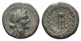 Lydia, Thyateira, 2nd century BC. Æ (22mm, 7.77g, 12h). Laureate head of Apollo r. R/ Filleted tripod; monogram above; all within wreath. BMC 3. Brown...