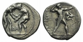 Pamphylia, Aspendos, c. 380/75-330/25 BC. AR Stater (21mm, 10.79g, 11h). Two wrestlers grappling; MΛ between. R/ Slinger standing r.; triskeles. Tekin...