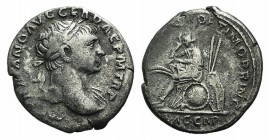 Trajan (98-117). AR Denarius (18mm, 3.06g, 6h). Rome, 108-9. Laureate bust r., slight drapery. R/ Dacian seated l. on pile of arms, in attitude of mou...