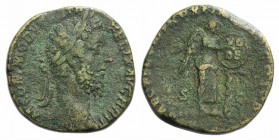 Commodus (177-192). Æ Sestertius (29mm, 21.47g, 12h). Rome, AD 186. Laureate head r. R/ Victory standing l., foot on helmet, inscribing shield sitting...